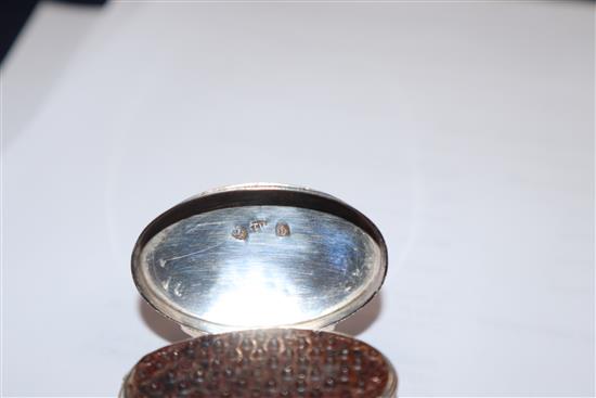 A George III engraved silver oval nutmeg grater by Joseph Wilmore, Birmingham, 1800, (grille hinge damaged), 46mm.